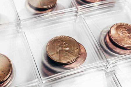 Photo for Photo of US president Lincoln cent coins collection in a clear plastic sheet numismatic holder. - Royalty Free Image