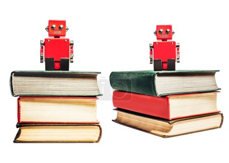 Foto de Foto aislada de robot de juguete rojo sentado en una pila de libros antiguos sobre fondo blanco. - Imagen libre de derechos