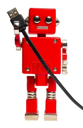 Photo for Isolated photo of red toy robot holding usb cable on white background. - Royalty Free Image