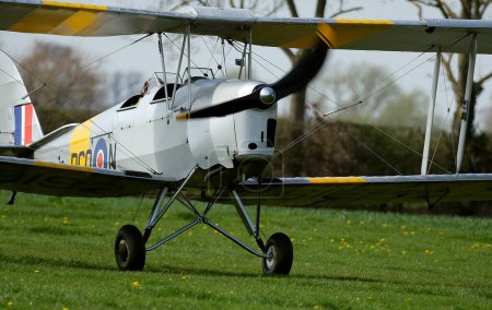 Photo for Breighton, Yorkshire, UK. May 2023. Civilian light aircraft on private airfield.  Bucker Jungman - Royalty Free Image