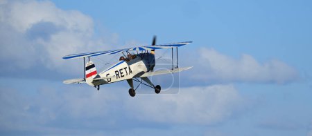 Photo for Breighton, Selby, Yorkshire, UK. April 2024. The Bcker B 131 Jungmann is a basic biplane trainer aircraft design and produced by the German aircraft manufacturer Bcker Flugzeugbau. - Royalty Free Image