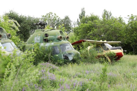Photo for Abandoned damaged russian military helicopter Mil Mi-2 Hoplite. broken air copter - Royalty Free Image