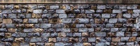 Foto de Muralla de piedra medieval. Textura áspera. Patrón de pared de ladrillo - Imagen libre de derechos