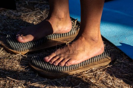 Photo for Feet on sharp nails sadhu board. Yoga meditation exercise - Royalty Free Image