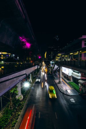 Photo for Blurred night traffic in Bangkok city Thailand. Rush hour traffic jam - Royalty Free Image