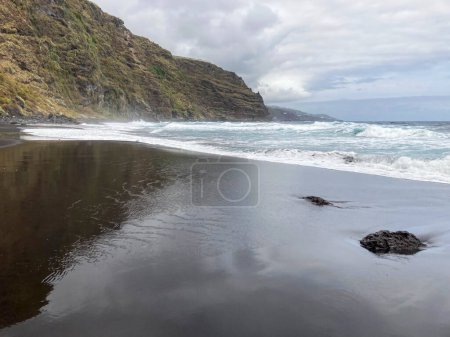 Photo for A young woman walking towards the Nogales beach, La Palma Island, Canary Islands, Spain. - Royalty Free Image