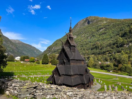 Photo for Autumn landscape in Wooden church of Borgund in south Norway - Royalty Free Image