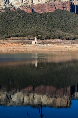 Lack water Sau Reservoir. The swamp is at very low water levels due to lack of rain. Desertification, climate change, environmental problems. Barcelona, Spain. February 2024