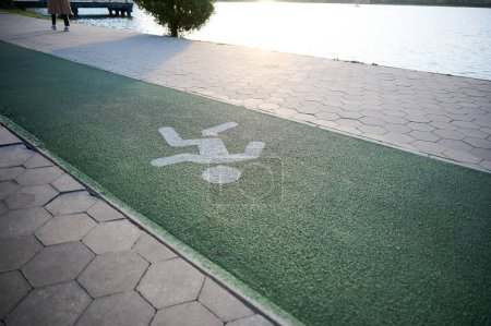 Photo for Jogging and cycling paths in a park with beautiful markings on a sunny day - Royalty Free Image