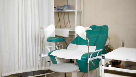 Empty gynecological chair for examination of girls and women. Women's health. Prevention illness. Early detection of cervix cancer. Examining and consulting patient in clinic.