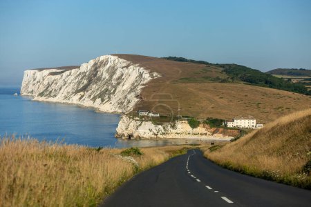 A view along the Military Road on the Isle of Wight with the cliffs at Freshwater Bay, and Tennyson Down under a blue sky