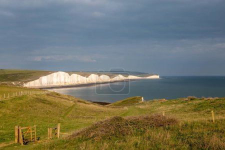 A view from a coastal path towards the Seven Sisters cliffs in Sussex