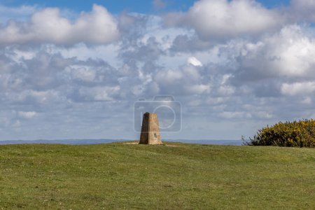 A trig point at Black Cap in the South Downs, on a sunny early spring day