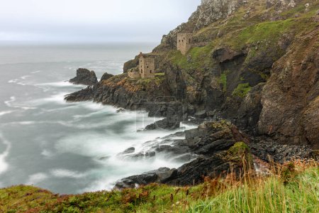A long exposure photograph of the rugged Cornish coastline