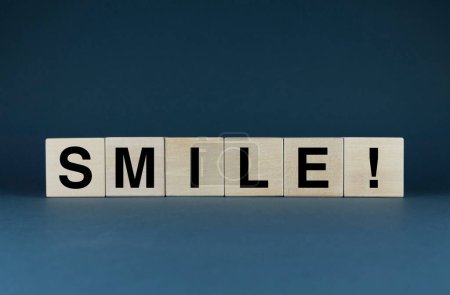 Photo for Smile. Cubes form the word Smile. The broad concept of the word smile applies to dentistry and happiness and beyond. - Royalty Free Image