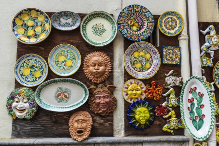 Photo for Monreale, Italy - May 12, 2023: Display of a souvenir shop with Trinacria and ceramic art in Monreale, Palermo, Sicily; Italy; - Royalty Free Image
