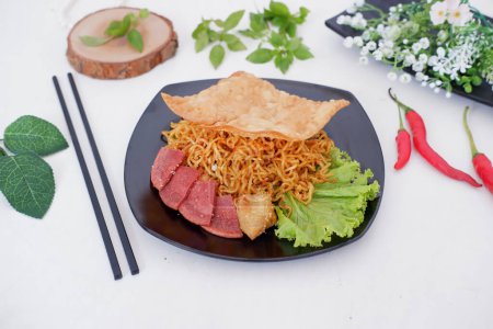 Photo for Fried noodle crackers with sliced meat and vegetables - Royalty Free Image