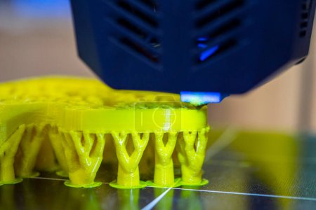 3D printer printing object close-up. Process creating three-dimensional model on 3d printer. Additive printer technology. 3D Prototyping. 3D design modeling. New modern innovation printing technology