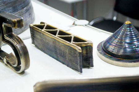 3d printed metal model close-up. Model printed on a 3D printer made of metal. Three-dimensional metal object created by a 3d printer from metal. 3D printing additive modeling manufacturing technology