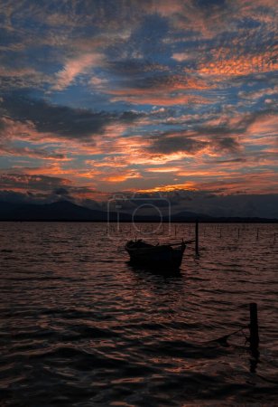 Photo for Fiery red super sunset in a fishing village in southern sardinia - Royalty Free Image