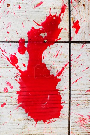 Photo for Abstract bloody scarlet stain on textured surface. Under the gun of a terrorist attack - Royalty Free Image