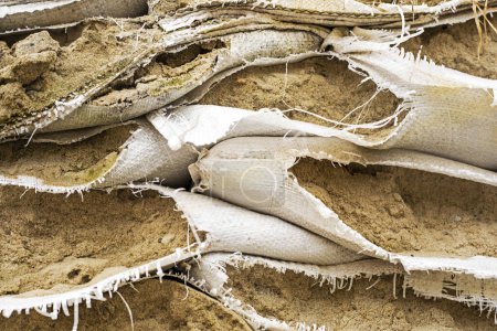 Photo for Closeup of torn sandbags at checkpoints, defense of ukraine. War in Ukraine - Royalty Free Image