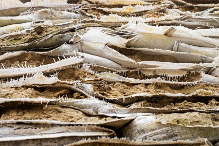 Photo for Closeup of torn sandbags at checkpoints, defense of ukraine. War in Ukraine - Royalty Free Image