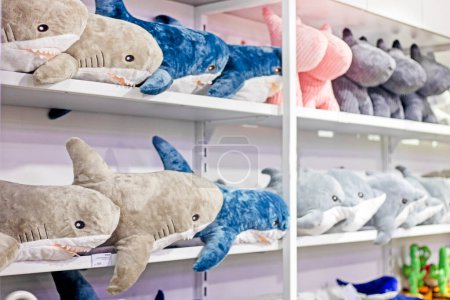 Photo for Cute funny soft toy dolphins and whales in the store. Ecology support - Royalty Free Image