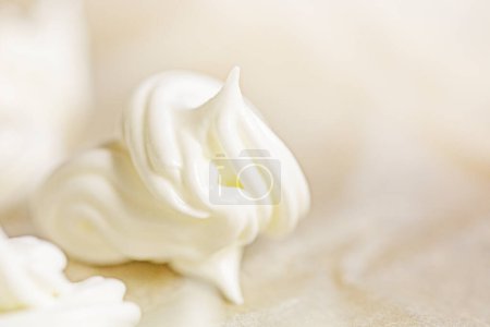 Photo for Prepare classic meringue by spreading on foil before baking. Festive mood - Royalty Free Image