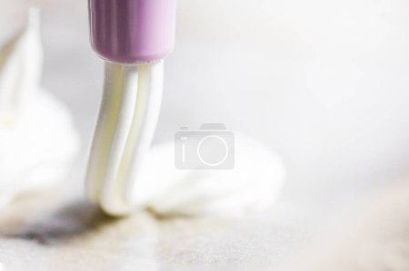 Photo for Prepare meringue with a pastry syringe at home. Festive mood - Royalty Free Image