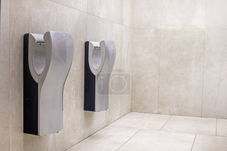 Photo for Light modern interior in the bathroom with hand dryers. horizontal - Royalty Free Image