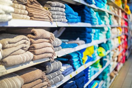Photo for Towels in a stack on the shelves in the supermarket. family shopping - Royalty Free Image