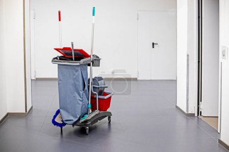Classic cleaning trolley. Broom, bucket, detergents, cleaning products in public places, hotels, supermarkets, airports, toilets