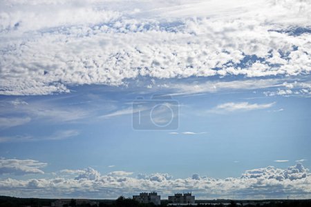 Photo for Beautiful blue sky with stormy and wavy white clouds before rain over the city. weather change - Royalty Free Image