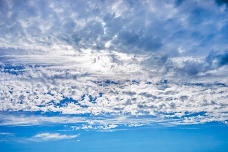 Photo for Blue sky with stormy and wavy white clouds before rain. weather change - Royalty Free Image