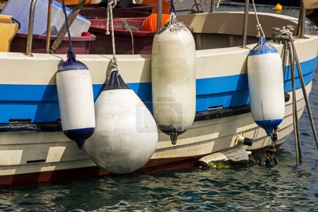 Photo for Hanging weights on a pleasure boat to balance movement on a sunny day. navigation - Royalty Free Image
