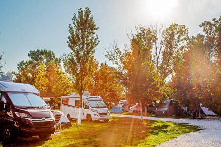 Photo for Camping life with motorhomes and cars and tents in the early morning. travel and vacation by car - Royalty Free Image