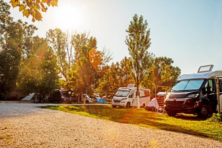 Photo for Camping life with motorhomes and cars and tents in the early morning. travel and vacation by car - Royalty Free Image