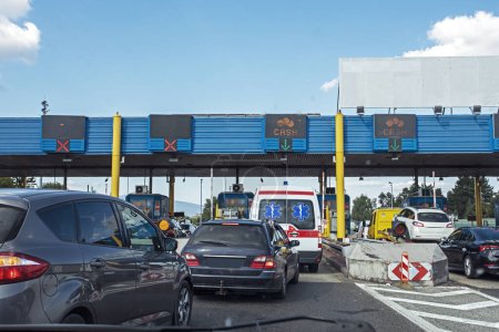 Photo for Traffic jam on a toll road in Europe on a sunny day. Travelling by car - Royalty Free Image
