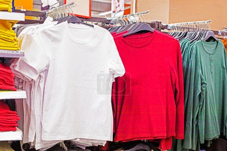 multi-colored men's T-shirts and raglans in the supermarket. Fashion & Style