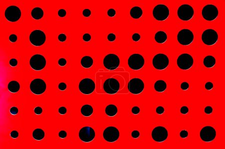 abstract red background with different round holes in modern interior