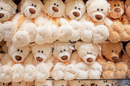 Photo for Soft toy white and brown teddy bears on the counter in a children's store - Royalty Free Image