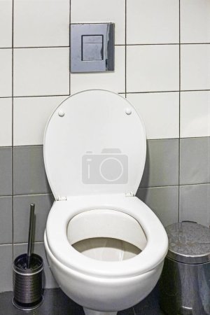 white open toilet in a stylish light interior