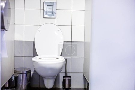 white open toilet in a stylish light interior