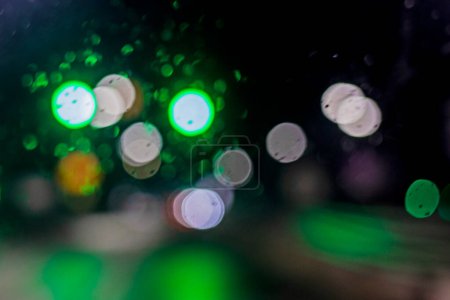 abstract blurred background of multi-colored lights of cars, on the road in the dark