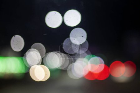 abstract blurred background of multi-colored car lights, in the dark