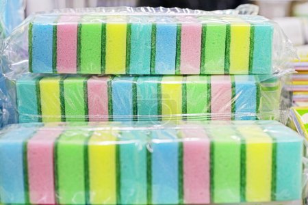 sponges for washing dishes and cleaning, packaged in transparent plastic. cleaning company