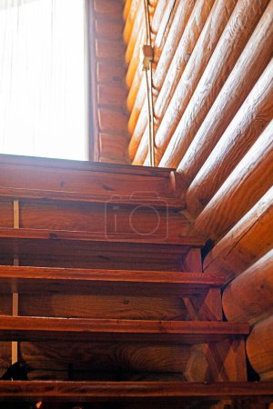 modern interior in a house made of solid pine wood with a staircase. home care