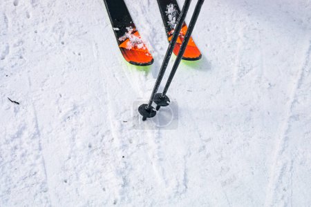 skis and poles on the ski slope. start of the ski season