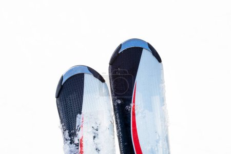 close-up of skis against the backdrop of a snowy slope. leisure